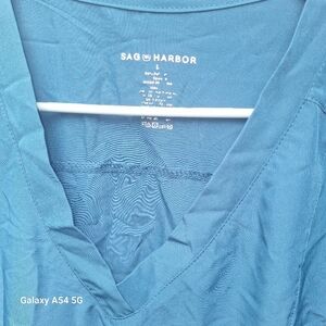 2 Sag Harbor Women's Scrub tops. One is size M One is size L. Caribbean Blue